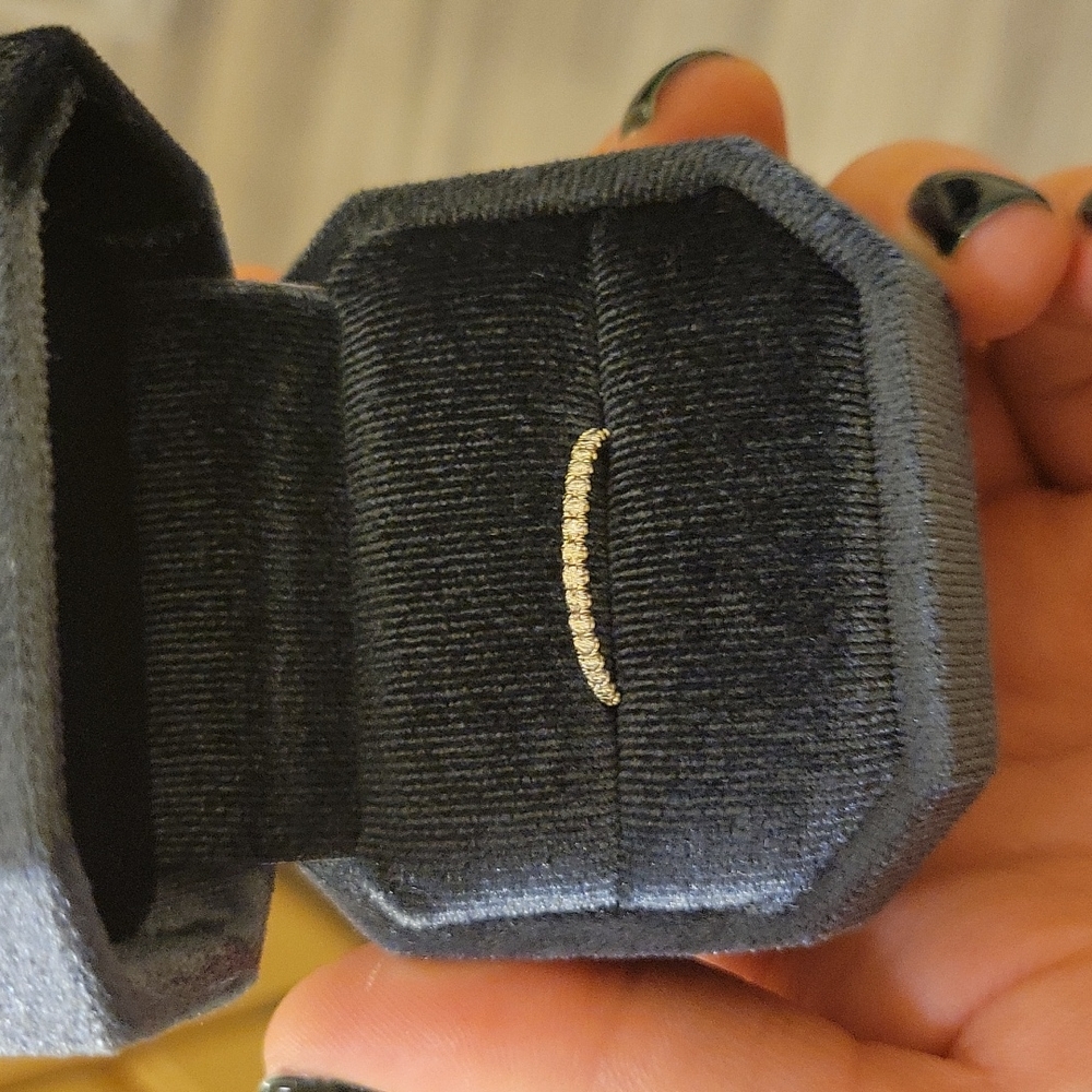 14k white gold moissanite band.